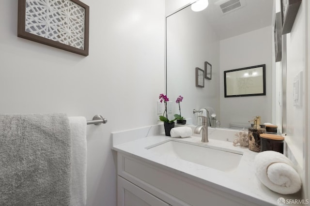 bathroom featuring vanity and visible vents