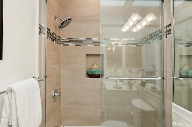 bathroom with a shower stall