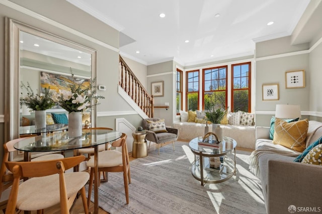 living room with crown molding, stairway, and recessed lighting