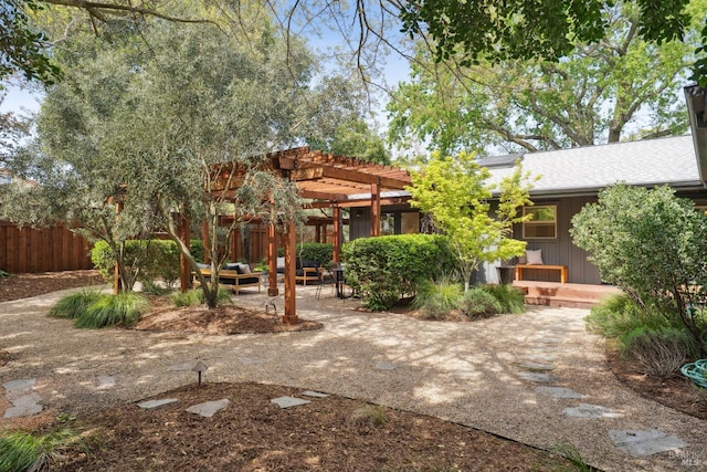 view of yard with fence, a patio, and a pergola
