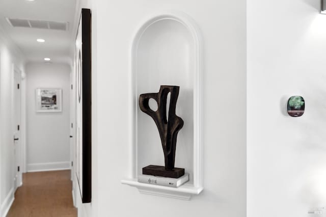 hallway with recessed lighting, carpet, visible vents, and baseboards