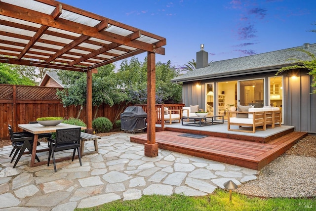 exterior space with outdoor dining space, outdoor lounge area, a pergola, grilling area, and fence