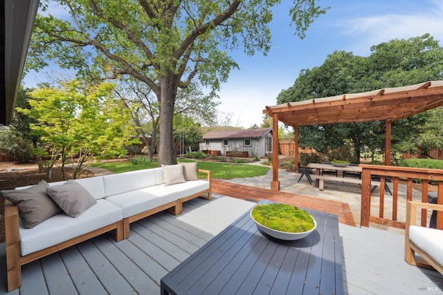 wooden deck featuring a pergola, outdoor lounge area, and an outdoor structure