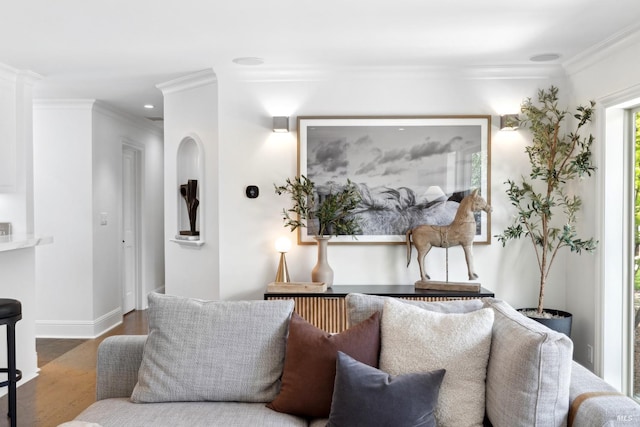 living area with crown molding, recessed lighting, and wood finished floors