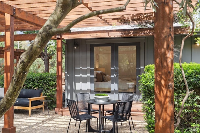 exterior space featuring french doors and a pergola