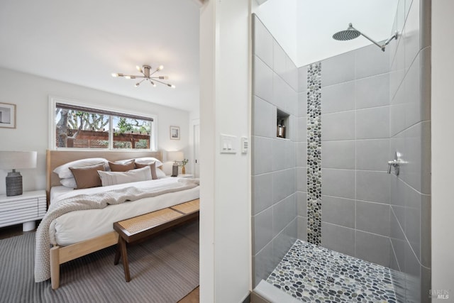 interior space featuring a chandelier and tiled shower