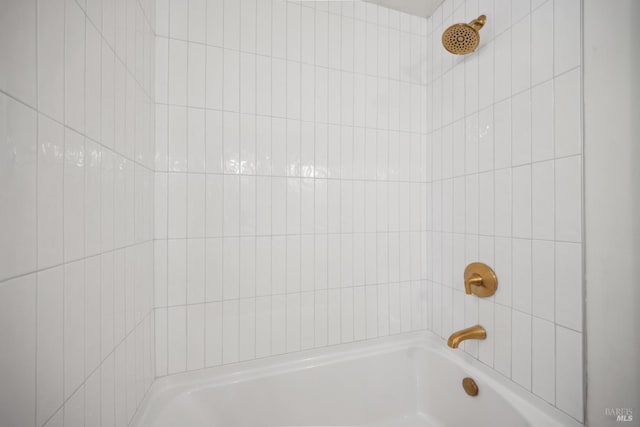 bathroom featuring a shower and a tub