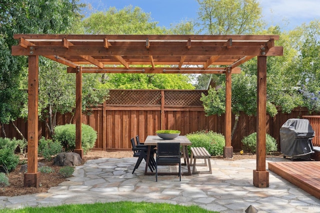 view of patio / terrace with a grill, a pergola, fence, and outdoor dining area