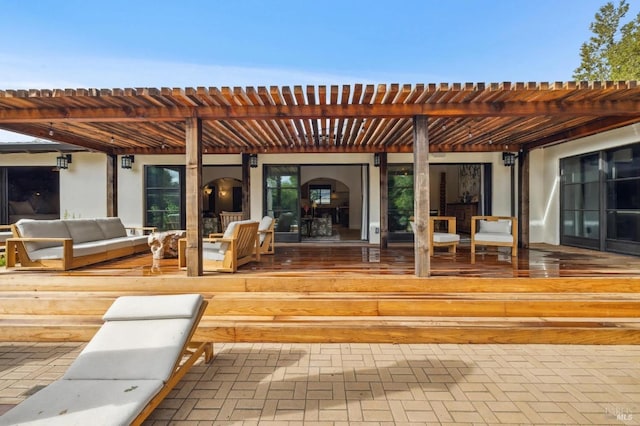 exterior space featuring an outdoor living space and a pergola