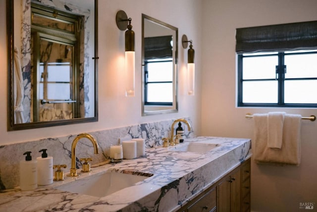 bathroom with double vanity and a sink