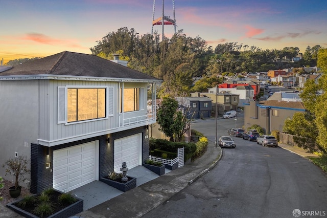 exterior space featuring a residential view, curbs, and sidewalks