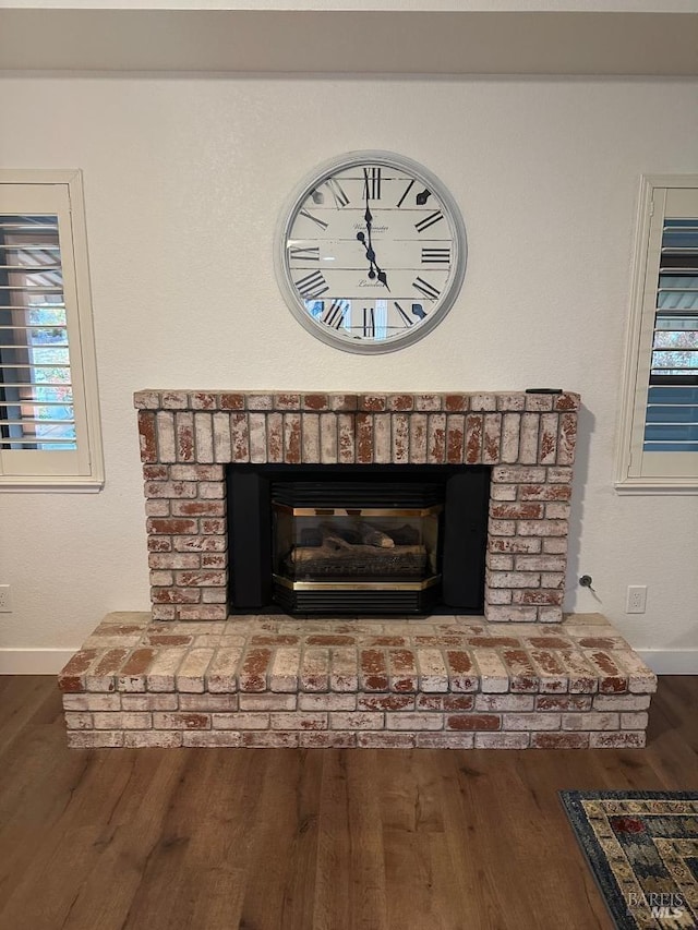 interior details with a fireplace and hardwood / wood-style flooring