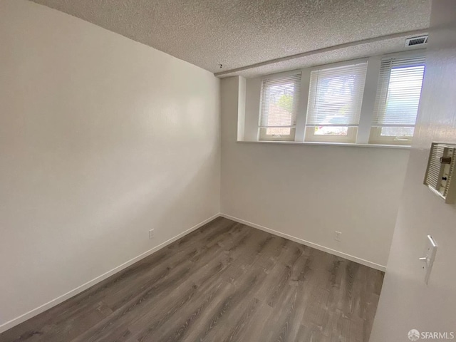 3410 Big Oak Ct, Hayward, CA 94542 - spare room with plenty of natural light, wood finished floors, and a textured ceiling