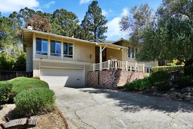 3410 Big Oak Ct, Hayward, CA 94542 - view of front of home featuring an attached garage, driveway, and a chimney