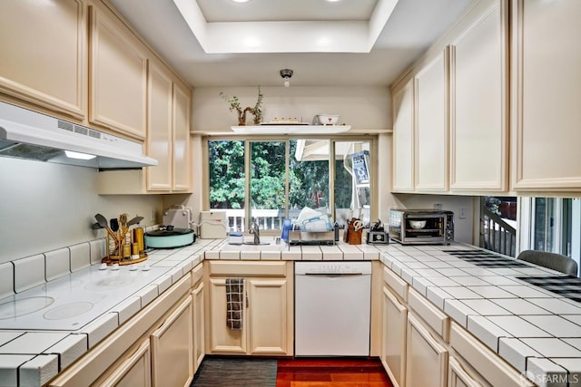 3410 Big Oak Ct, Hayward, CA 94542 - kitchen featuring white appliances, tile counters, a tray ceiling, and under cabinet range hood