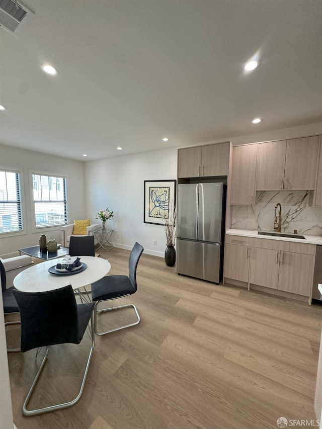 dining area with light wood-type flooring, visible vents, baseboards, and recessed lighting