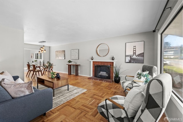 458 Alhambra Rd, South San Francisco, CA 94080 - living area featuring baseboards, an inviting chandelier, and a fireplace
