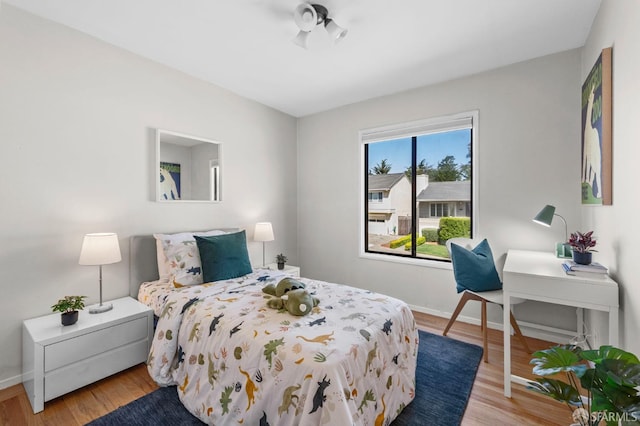 458 Alhambra Rd, South San Francisco, CA 94080 - bedroom featuring baseboards and wood finished floors