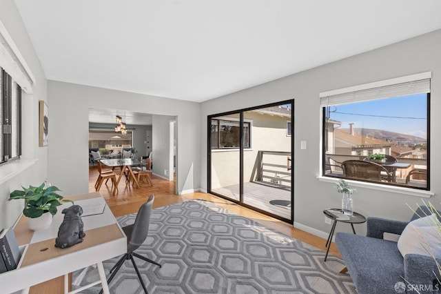458 Alhambra Rd, South San Francisco, CA 94080 - living room with baseboards, a notable chandelier, and wood finished floors