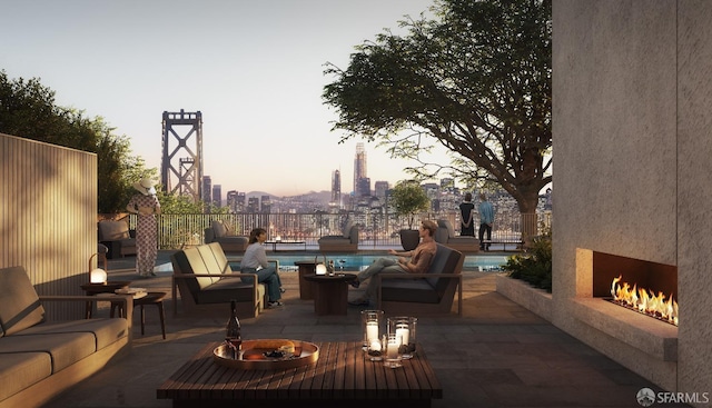 view of patio featuring a fenced in pool, an outdoor living space with a fireplace, fence, and a city view