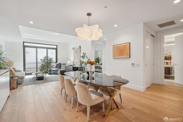 dining space featuring recessed lighting, baseboards, light wood finished floors, and visible vents