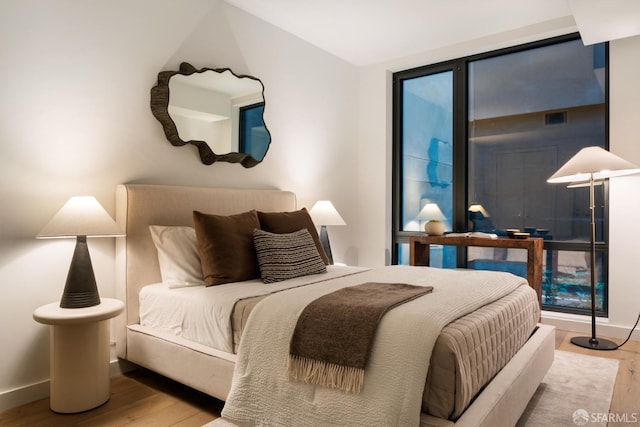 bedroom featuring wood-type flooring