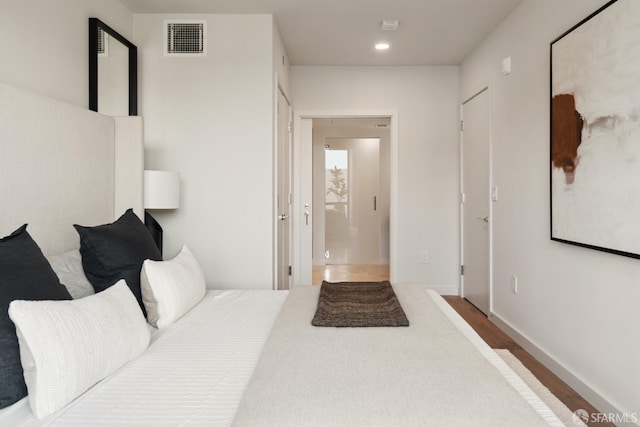 bedroom featuring hardwood / wood-style flooring