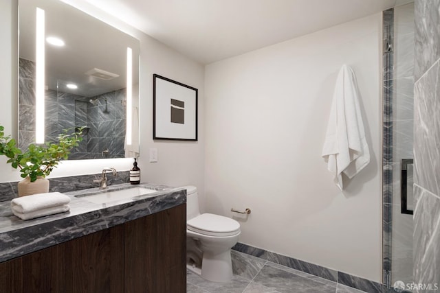 bathroom featuring vanity, toilet, and walk in shower