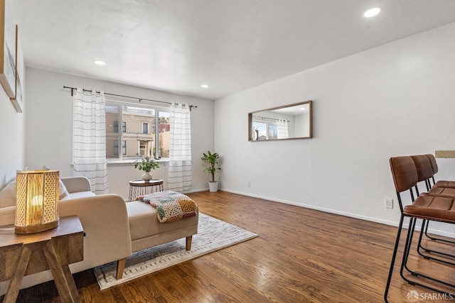 sitting room with recessed lighting, wood finished floors, and baseboards