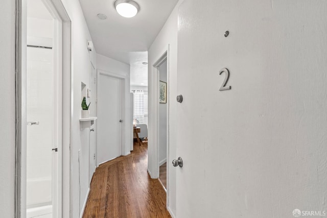 corridor with wood finished floors