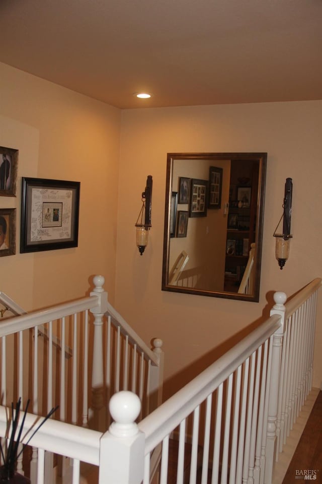 staircase featuring recessed lighting