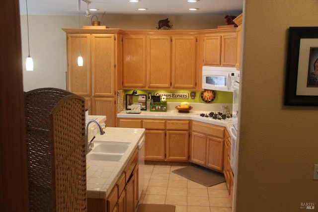 kitchen with white appliances, tile countertops, light tile patterned flooring, a sink, and recessed lighting