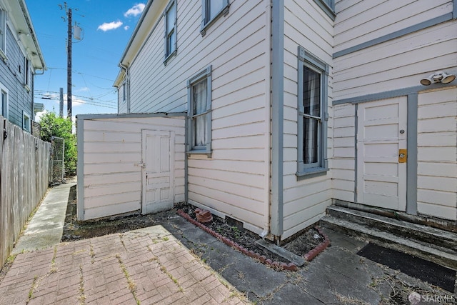 view of side of property with a patio