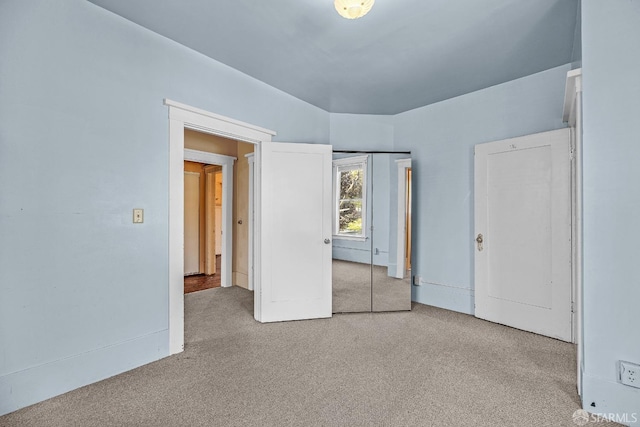 unfurnished bedroom featuring light colored carpet