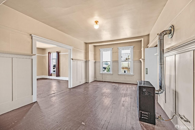 interior space featuring dark hardwood / wood-style floors and heating unit