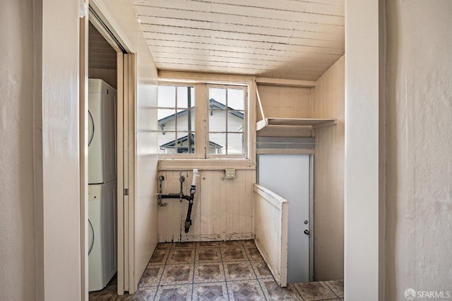 interior space featuring stacked washer and dryer