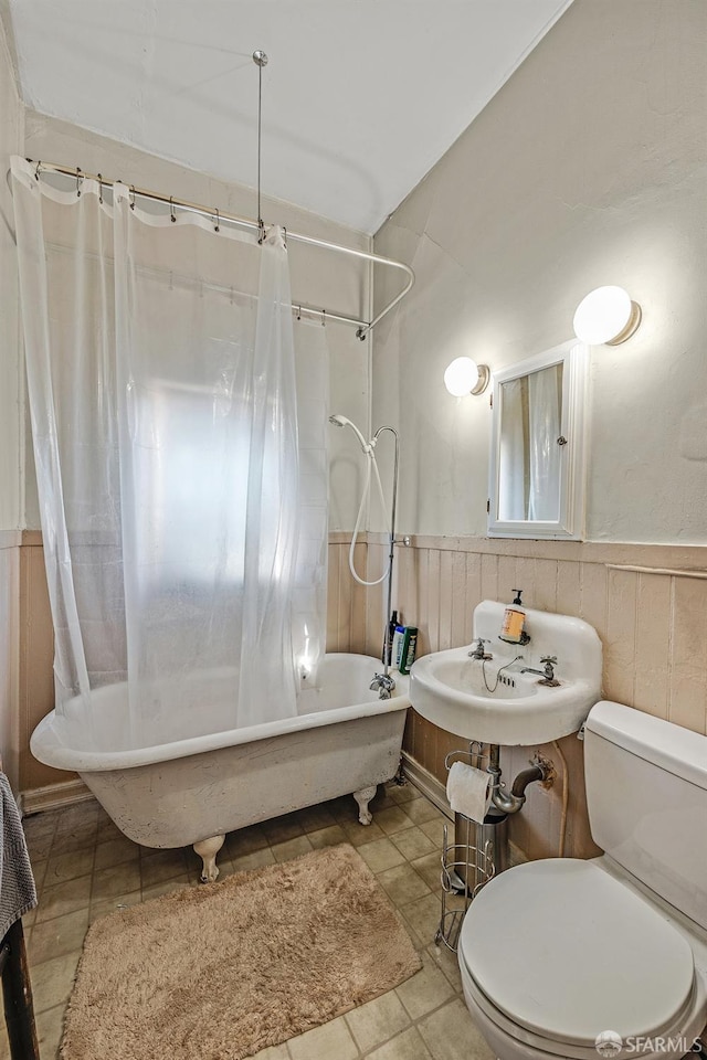 bathroom featuring tile patterned floors and toilet