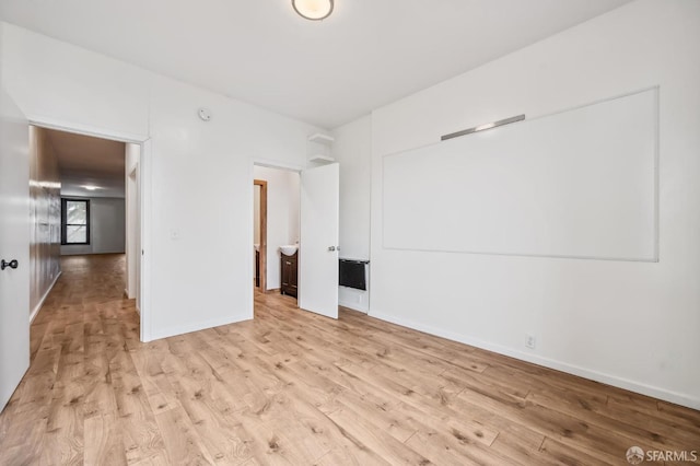 unfurnished room featuring light hardwood / wood-style flooring