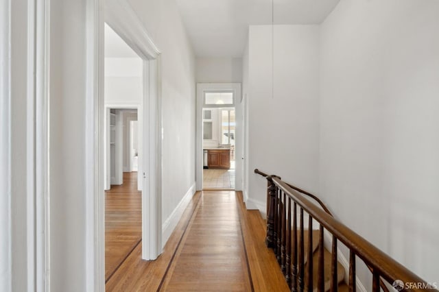 hall with light wood-type flooring