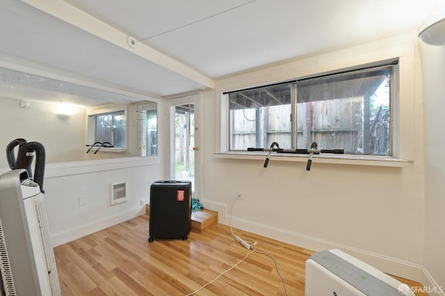 exercise area featuring hardwood / wood-style floors