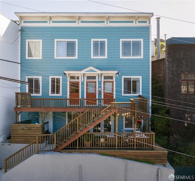 view of front of property with stairway