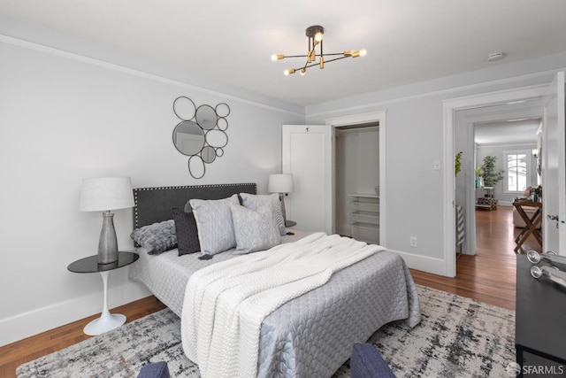 287 Staples Ave, San Francisco, CA 94112 - bedroom with baseboards, a chandelier, and wood finished floors