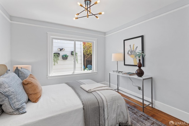 287 Staples Ave, San Francisco, CA 94112 - bedroom featuring a chandelier, wood finished floors, and baseboards