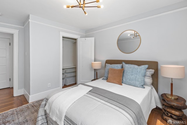 287 Staples Ave, San Francisco, CA 94112 - bedroom with wood finished floors, a chandelier, and baseboards