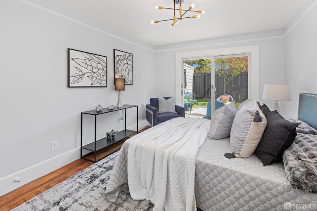 287 Staples Ave, San Francisco, CA 94112 - bedroom featuring a chandelier, wood finished floors, baseboards, access to exterior, and crown molding