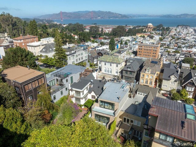 bird's eye view with a water and mountain view