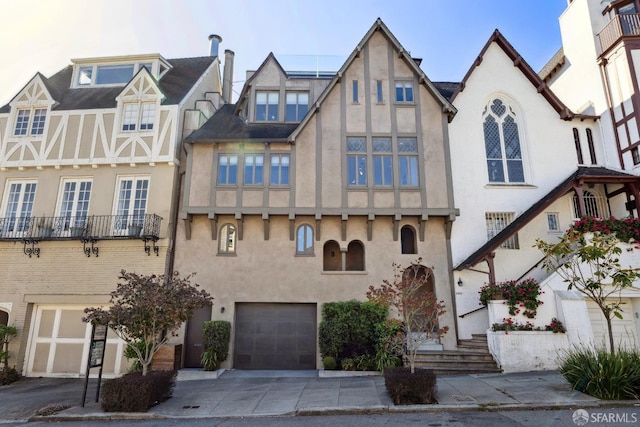 tudor house featuring a garage