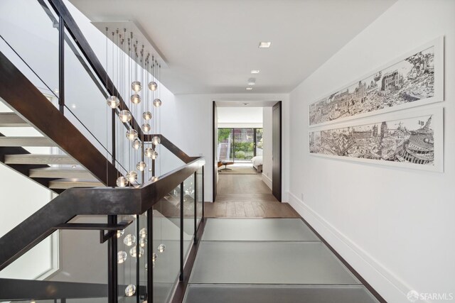 stairway featuring hardwood / wood-style flooring