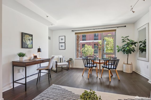 dining room featuring dark hardwood / wood-style flooring