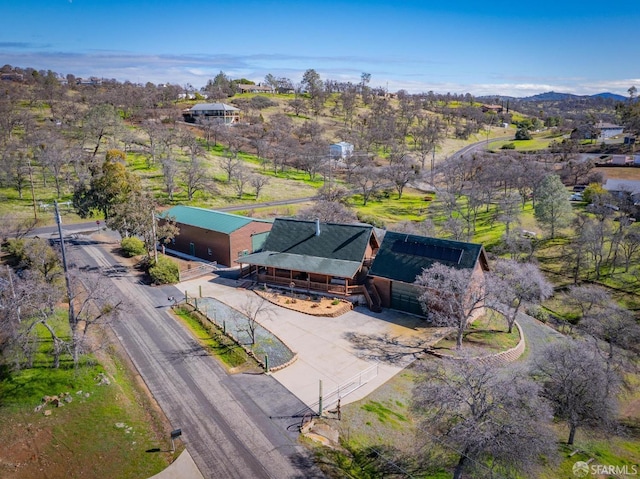 drone / aerial view featuring a mountain view